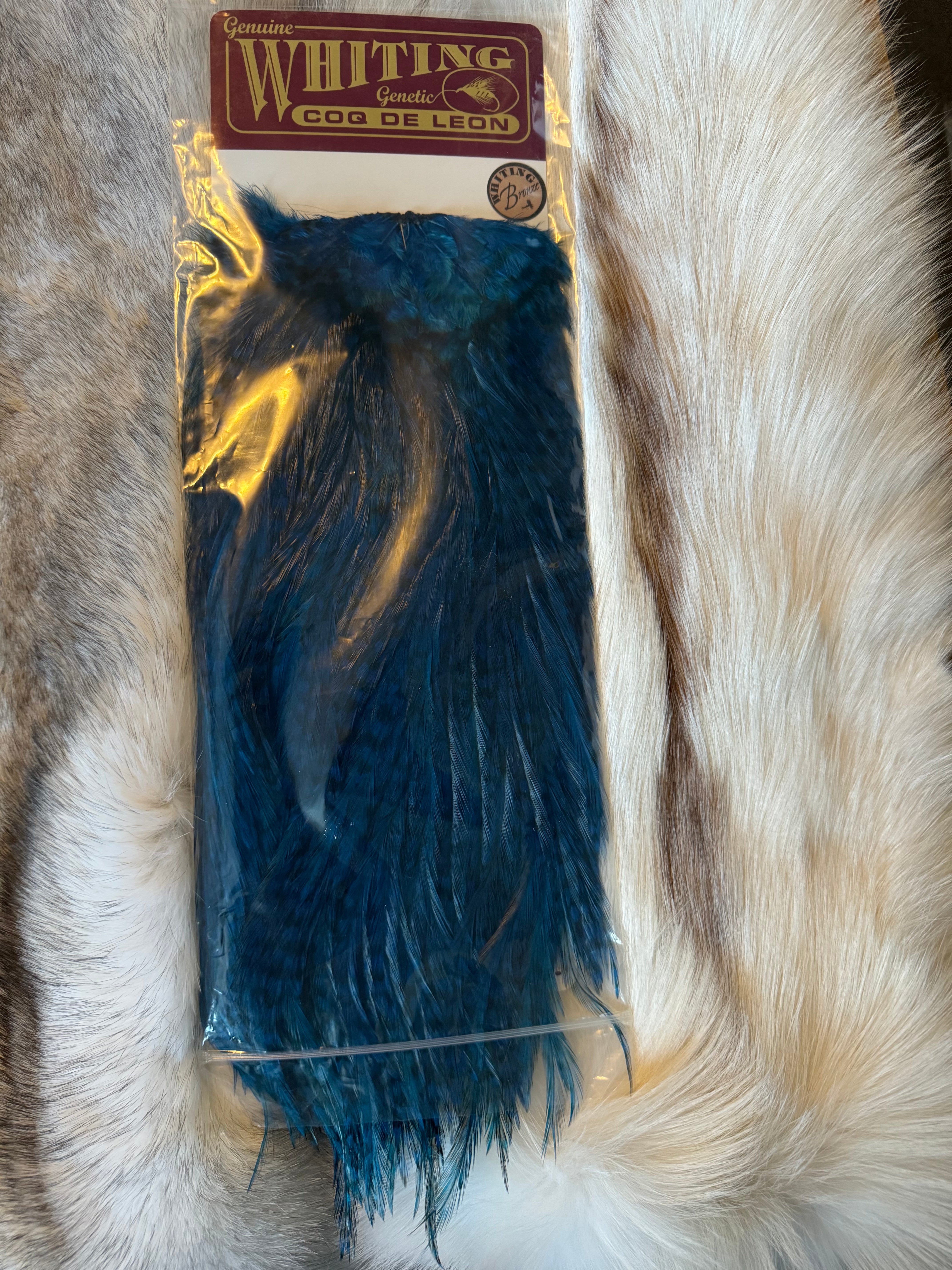Whiting Capes - COQ DE LEON - Rooster Saddle (Bronze) - Grizzly dyed Kingfisher Blue